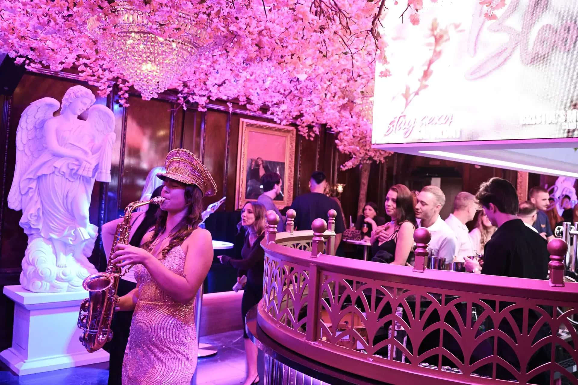 Live sax player performing on the balcony at Bloom cocktail bar, Park Street, Bristol