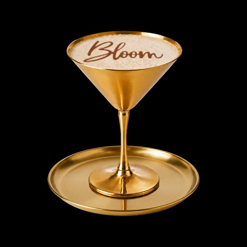 Espresso Yourself cocktail in a gold martini glass with Bloom written in the foam, at Bloom cocktail bar, Park Street, Bristol