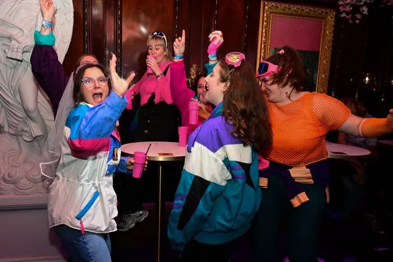 A hen party in fancy dress posing together in the VIP rooms at Bloom, Park Street, Bristol